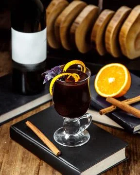 Beverage topped with basil placed on the book Stock Photos