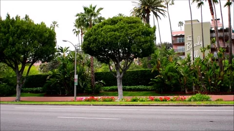 The Beverly Hill Hotel on Sunset Blvd.in Beverly Hills. and cars driving by Stock Footage 66508908
