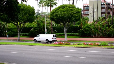 The Beverly Hill Hotel on Sunset Blvd.in Beverly Hills. and cars driving by Stock Footage 66509302