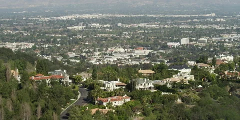 Beverly Hills mansions on hillside overlooking cityscape, seen from Charles and Stock Footage 59211034