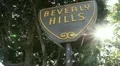 Beverly Hills sign handheld with sun and lens flare HD Footage