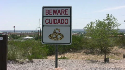 Beware of rattle snake sign Stock Footage 500327