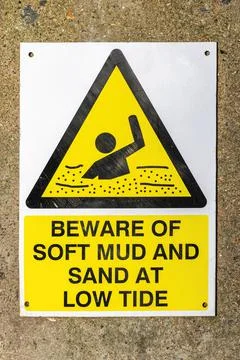 Beware of Soft Mud and Sand at Low Tide sign Stock Photos