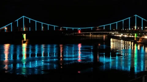 Bewitching color illumination of the bridge reflected in water at night Stock-Footage 132194293