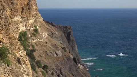 Bewitching look of seashore landscape with cliff over blue sea 動画素材 131106241