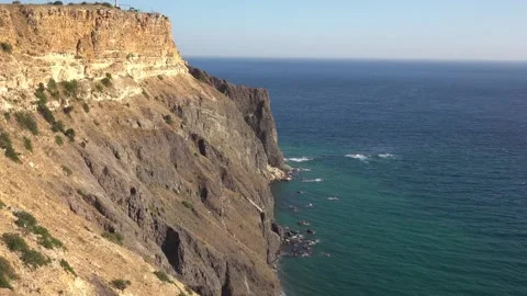 Bewitching look of seashore landscape with cliff over blue sea 動画素材 131106256