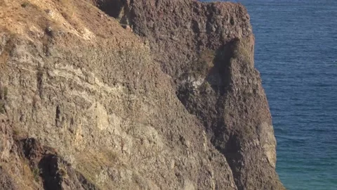 Bewitching look of seashore landscape with cliff over blue sea Stock Footage 131106270