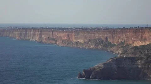 Bewitching look of seashore landscape with cliff over blue sea 動画素材 131106282