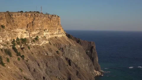 Bewitching look of seashore landscape with cliff over blue sea 動画素材 131106306