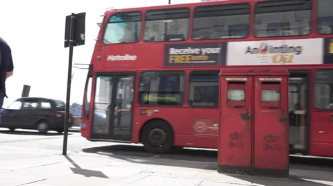 Bexit scene, Royal Mail, A Red Bus Passes by a mailbox in London United Kingdom Stock Footage 39301627