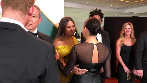 Beyonce and Jay-Z meet Meghan and Harry at Lion King premier Stock Footage 148576100
