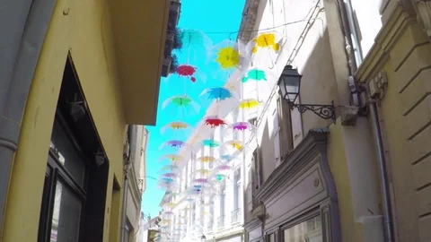 Beziers. Street de la Citadelle decorated with colorful umbrellas Stock Footage 77723341