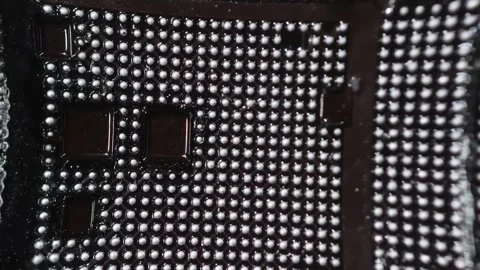 BGA chip solder balls macro Stock Footage 347981416