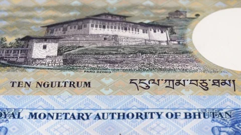 Bhutan ngultrum notes slow tracking. Slider shot, low angle. 4K Stock Footage 126003040