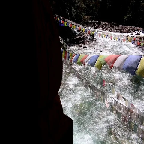 Bhutan river with prayer flags from a bridge Stock Footage 69369202