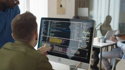 Bi-ethnic Programmers Looking at Coding Script on Screen of PC at Startup Office Stock Footage 277414138