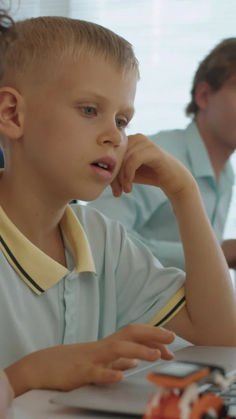 Bi-ethnic Schoolboys Doing Online Task on Laptop at Class Stock Footage 280638308