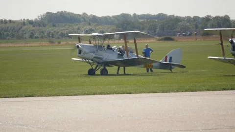 Bi plane prepares for takeoff Stockbeeldmateriaal 115058562
