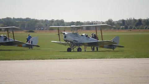 Bi plane prepares for takeoff in slow motion 库存影片 115058545
