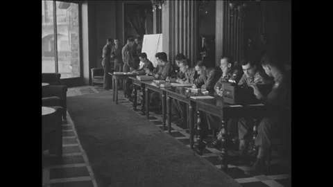 BIARRITZ - 1930s - Young men interview for positions, fill out forms, and meet Stock Footage 341515757