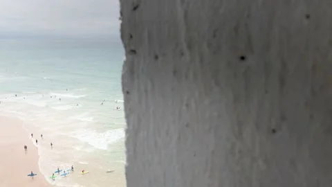 Biarritz beach surf classes revealing slider wide shot Stock Footage 137972992