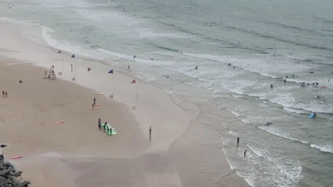 Biarritz beach wide static shot surf lessons Stock Footage 137973087