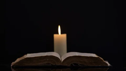 Bible and Candle on Background Stock-Footage 130157267