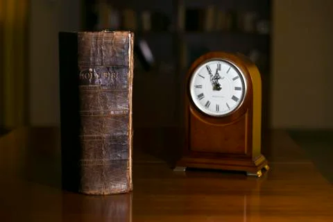 Bible and clock Stock Photos