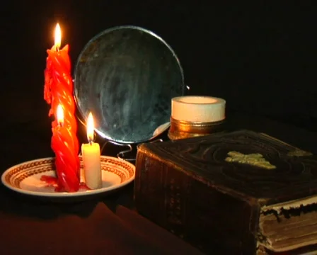 Bible on a background conflagrant candles Stock Footage 493418