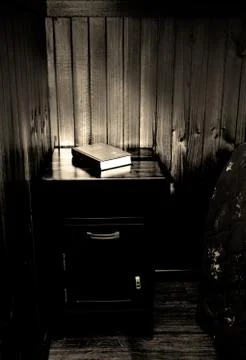 Bible on bed side table Stock Photos