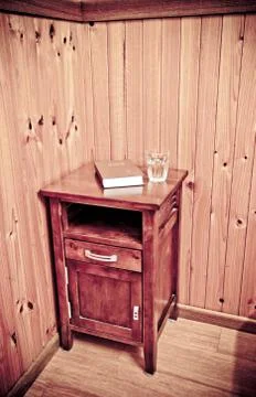 Bible on bed side table Stock Photos