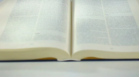 Bible Book scrolling by hand 2a Stockbeeldmateriaal 625698