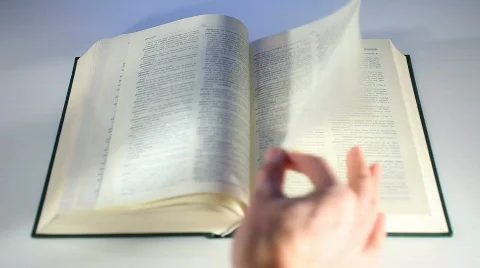 Bible Book scrolling by hand 3a Stockbeeldmateriaal 649610