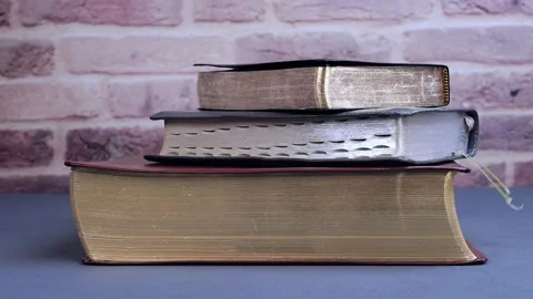 Bible falling for communion and study on gray table Stock Footage 310604574
