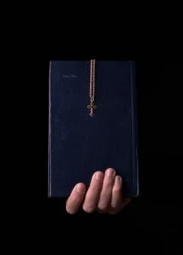 Bible in hand Stock Photos