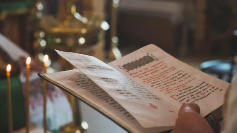 The bible in the hands of the priest Stock Footage 157491498