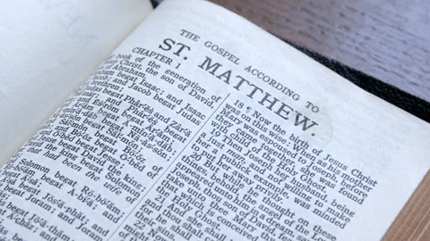 Bible open to the book of Matthew Stock Footage 166702576