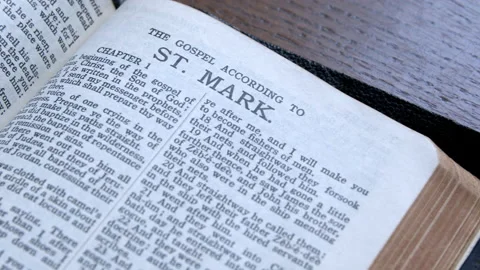 Bible open to the gospel of Mark. Stock Footage 166702581
