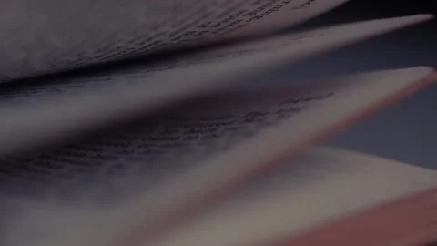 Bible pages falling in slow motion Stock Footage 145880664