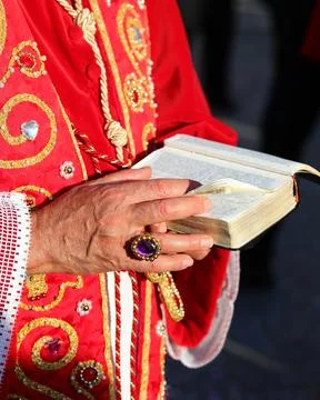 Bible with the sacred scriptures in the hands of the bishop with a ring wit.. 写真素材