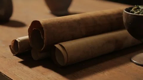 Bible scene: closeup of the scripture scrolls on the dining table. Stock Photos