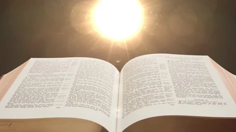 The bible scriptures and optical flares, the holy book of Christians Video stock 139198553