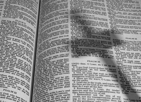 Bible with shadow of a cross Fotos de archivo