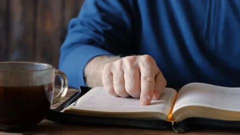 Bible study with a cup of coffee Stock Footage 129576300