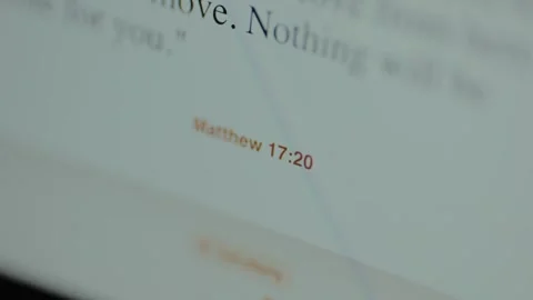 Bible verse reference Matthew 17:20, digital version of the Holy Bible Stock Footage 326913432