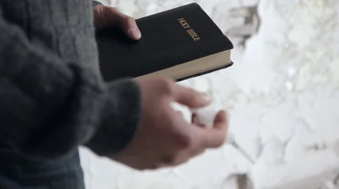 The Bible vs The Needle Stock Footage 56565843