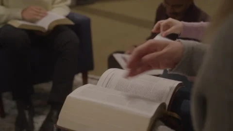 Bibles Being Opened at a Group Bible Study Stock Footage 208802296