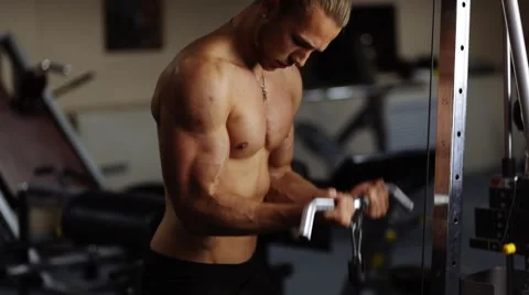 Biceps curls in machine. Loop Stock Footage 55007900