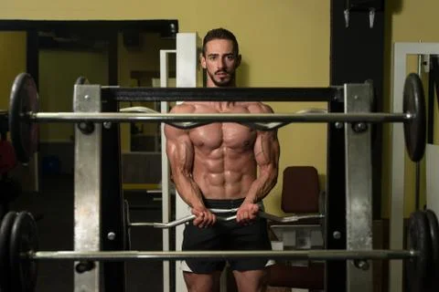 Biceps Exercise With Barbell Stock-Fotos