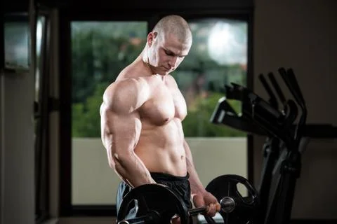 Biceps Exercise With Barbell Stock Photos